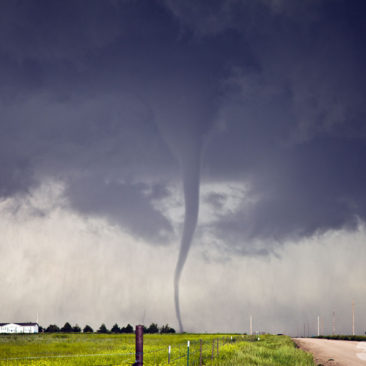 Satellite tornado moves across road.