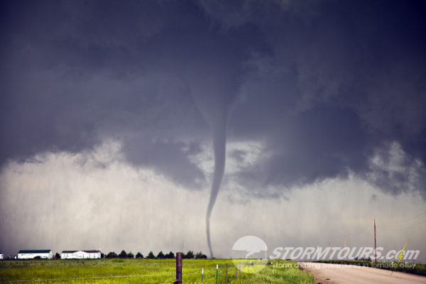 Satellite tornado moves across road.