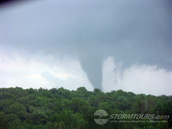 tornado passing over hills