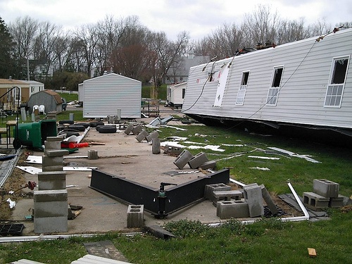 tornado damaged mobile home